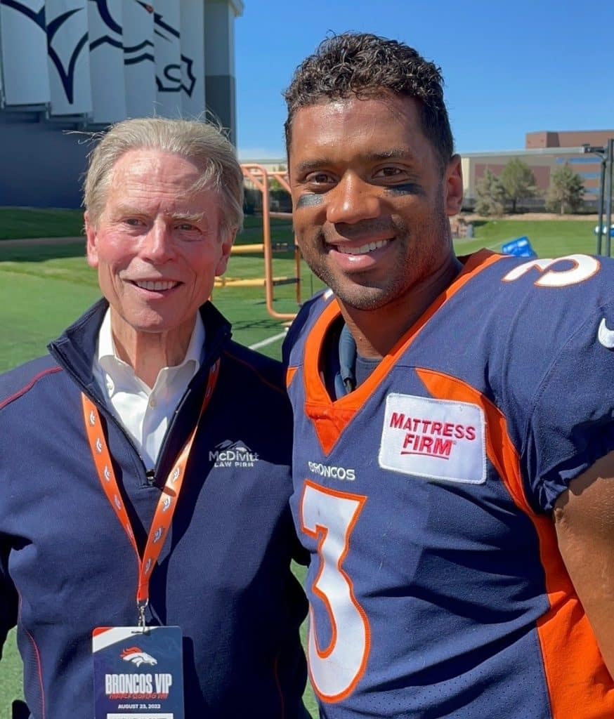 Mike McDivitt with Broncos Russell Wilson