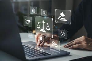 The Legal Process - legal services icons floating above a laptop