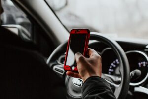 Distracted Driving Accidents - person looking at their phone while driving