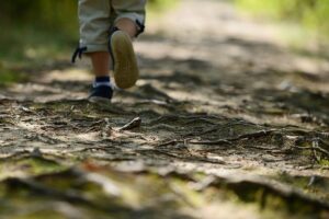 person running down a dirt path