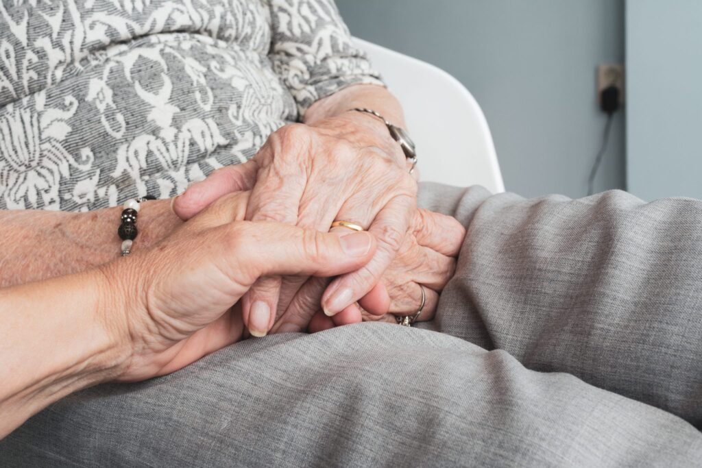 comforting an elderly woman