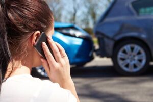 A person calling for help after a car accident